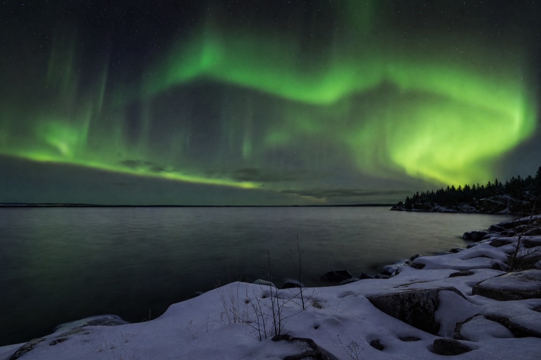 Vast open water of Great Slave Lake stretching to the horizon under a huge northern sky