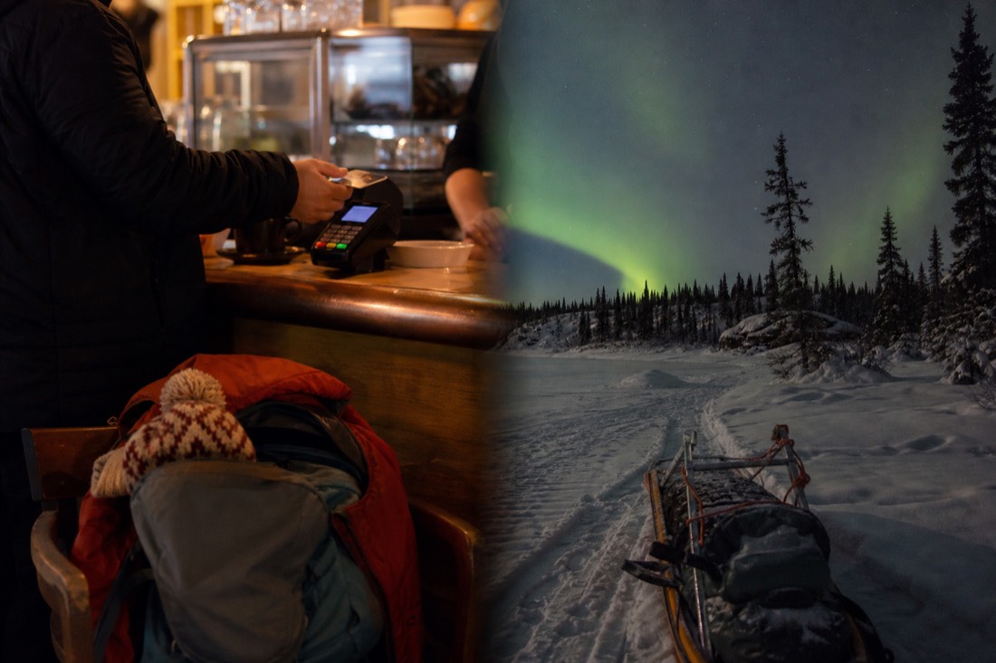 Traveller tapping a bank card on a payment terminal at a warm Yellowknife cafe counter with snow gear piled on a chair