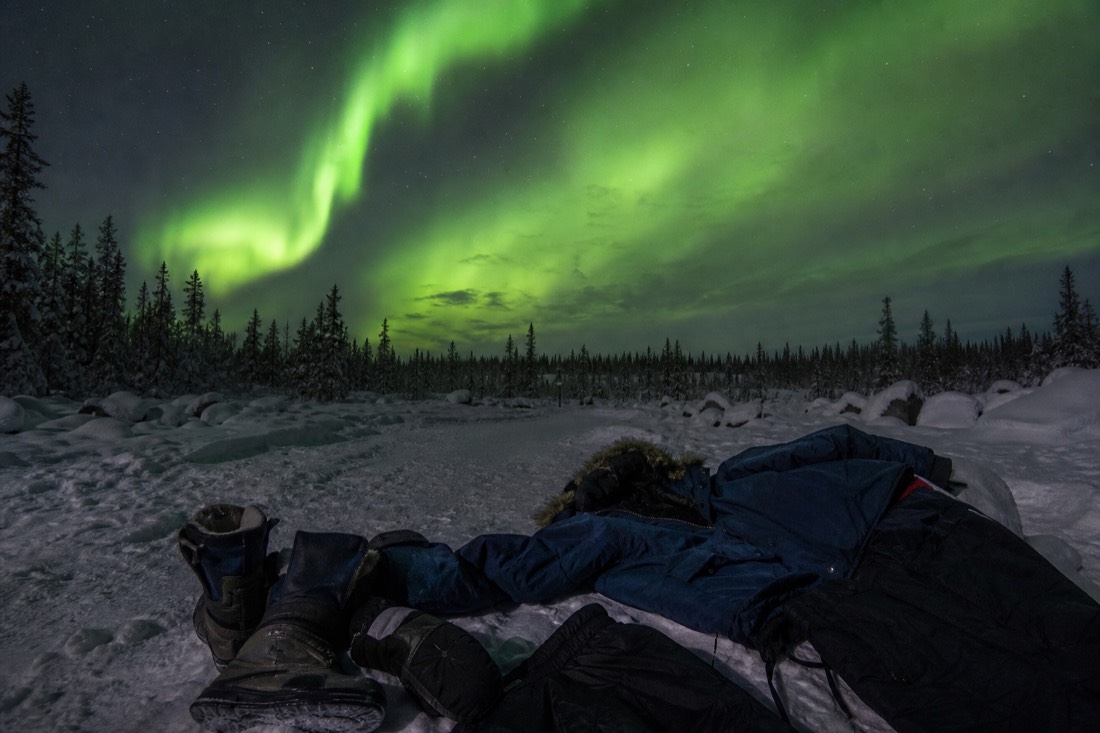 Rented arctic parkas, insulated pants, boots and mitts laid out ready for a December night in Yellowknife
